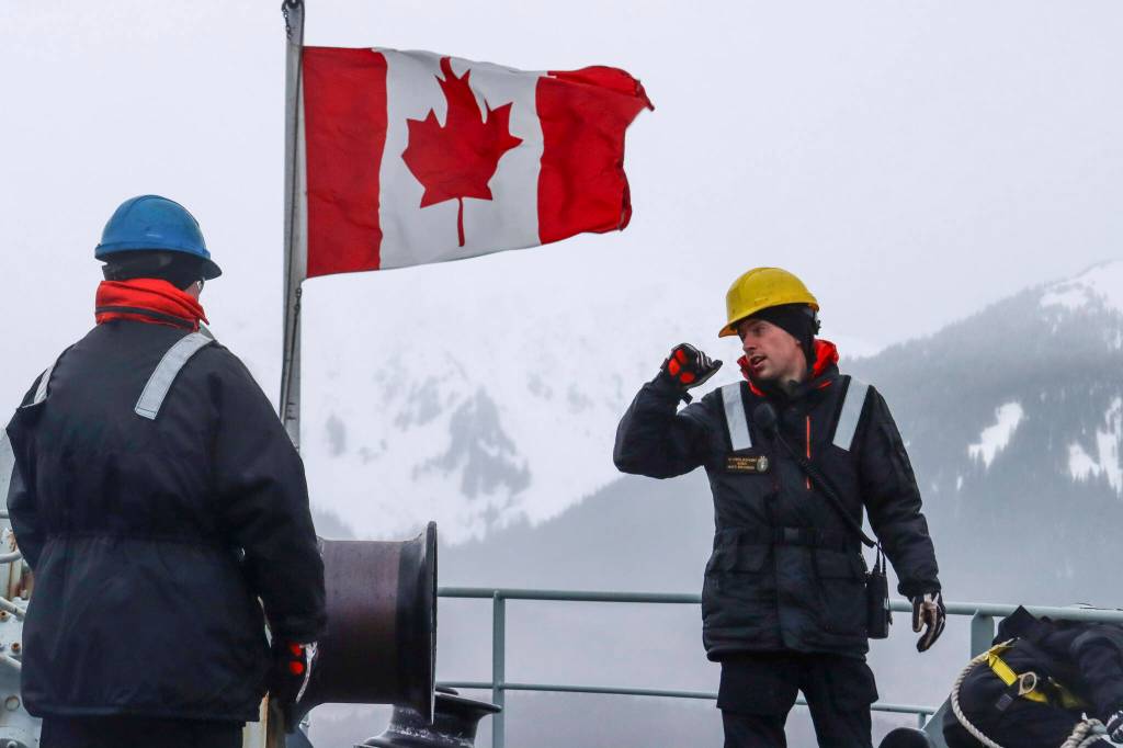 Sailor First Class Khye Krolikowski, in yellow hard hat, directs an anchor detail aboard Her Majestys Canadian Ship Brandon as they drop anchor near the Stephens Passage on March 6, 2022 as part of exercise Arctic Edge 2022. (Michael S. Lockett / Juneau Empire)