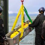 Royal Canadian Navy sailors load the remote environmental monitoring units unmanned underwater vehicle onto a small boat in Stephens Passage on March 6, 2022, as part of exercise Arctic Edge 2022. (Michael S. Lockett / Juneau Empire)