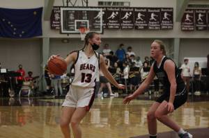 Courtesy Photo / Hayley Gilson 
JDHS Skylar Tuckwood (13) dribbles while defended by TMHS Ashlyn Gates (2). The JDHS girls won the game 54-29 in large part due to Tuckwoods 20 points and seven steals.