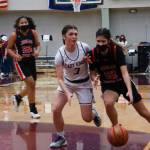 JDHS Trinity Jackson (12) dribble while defended by KHS Paige Boehlert (3) during the Region V 4A championship game. Ketchikan High School won the tournament, securing an automatic berth in the state tournament. Juneau-Douglas High School: Yadaa.at Kalé will find out Sunday if they will be heading to state, too. (Courtesy Photo / Jeff Lund)