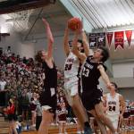 JDHS Orion Dybdahl (20), a junior, rises for a shot in the Region V 4A Tournament championship game against Ketchikan High School. A buzzer-beater by Dybdahl secured the Crimson Bears and tournament win and state tournament berth. (Courtesy Photo / Jeff Lund)