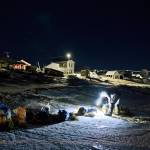 Musher Dallas Seavey tends to his team during the Iditarod Trail Sled Dog Race in Unalakleet, Alaska on Sunday, March 13, 2022. (Marc Leste r/ Anchorage Daily News)
