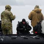 Navy explosive ordnance disposal technicians, assigned to Explosive Ordnance Disposal Mobile Unit (EODMU) 1, conduct safety checks prior to dive operations to reacquire, identify and neutralize inert mine shapes in the Gastineau Channel near Juneau, Alaska, March 11, 2022, as part of Exercise Arctic Edge 2022 (U.S. Navy / Lt. John J. Mike)