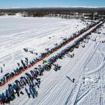A competitor mushes across Willow Lake during the restart of the Iditarod Trail Sled Dog Race on March 6, 2022, in Willow, Alaska. Two back-of-the-pack mushers had to be rescued in separate incidents from race Friday, March 18, after winds from a severe ground storm caused deteriorating conditions, race officials said. (Loren Holmes / Anchorage Daily News)