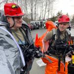 National Guardsmen Sgt. Andrew Hunt and Sgt. Jason Williams, survey team members for the 103rd Civil Support Team, suit up as they prepare to investigate a simulated hazardous material situation in an exercise with Juneaus emergency organizations on march 22, 2022. (Michael S. Lockett / Juneau Empire)