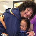 Diane Kaplan connects with a child during a 2017 visit with the Foundation Board to Oscarville on the Kuskokwim River near Bethel. (Courtesy photo / Rasmusen Foundation)