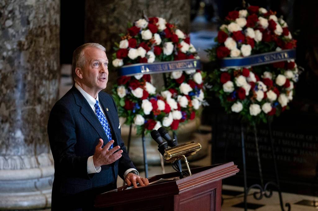 Sen. Dan Sullivan, R-Alaska, speaks during a ceremony for the late Rep. Don Young, R-Alaska, in Statuary Hall as he lies in state on Capitol Hill in Washington, Tuesday, March 29, 2022. Young, the longest-serving member of Alaskas congressional delegation, died Friday, March 18. He was 88. (Bill Clark/Pool Photo via AP)