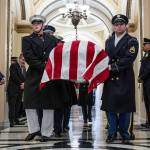 An honor guard carries the flag-draped casket of former Rep. Don Young, R-Alaska, into the U.S. Capitol where he will lie in state in Washington, Tuesday, March 29, 2022. (Jim Watson/Pool Photo via AP)