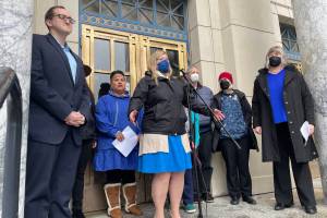 Rep. Geran Tarr, D-Anchorage, center, speaks as state lawmakers and childrens welfare advocates attend a Blue Shirt Day event at the Alaska State Capitol, honoring the beginning of Child Abuse Prevention Month on April 1, 2022. (Michael S. Lockett / Juneau Empire)