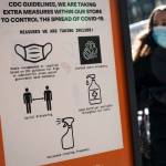 Pedestrians wearing protective masks walk along Broadway in the SoHo district of New York, Friday, March 4, 2022. COVID-19 hospitalization numbers have plunged to their lowest levels since the early days of the pandemic, offering a much needed break to health care workers and patients alike following the omicron surge. (AP Photo / John Minchillo)
