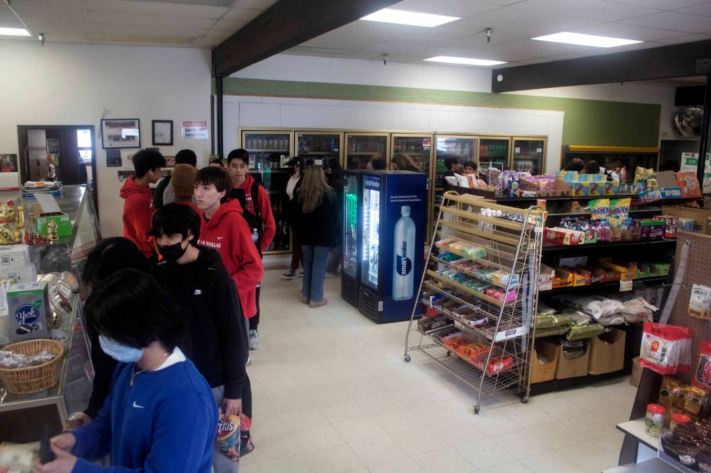 Mark Sabbatini / Juneau Empire 
A line of customers snakes its way around J&J Deli and Asian Mart. While the business is a favorite of government workers and students alike, it is set to close in August unless a buyer is found.