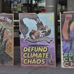 Members of local environmental group 350Juneau and the Womens Earth and Climate Action Network displayed signs in front of the downtown Juneau branch of Wells Fargo on Monday, April 11, 2022, as part of a demonstration urging the companys corporate leadership to cease funding of fossil fuels. (Peter Segall / Juneau Empire)