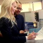 Kelly Tshibaka, left, a Republican, smiles as she officially files to run in Alaska's U.S. Senate race, Monday, April 11, 2022, while her husband, Niki Tshibaka, looks on at the Division of Elections office in Anchorage, Alaska. Eleven other candidates have signed up so far in the Senate race, including incumbent U.S. Sen. Lisa Murkowski, also a Republican. (AP Photo / Mark Thiessen)