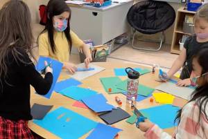 This screenshot from a video shown during a Juneau School District Board of Education meeting shows Riverbend Elementary School students working on a project. The school may soon have a new name, Kaxdigoowú Héen Elementary School. The name translates to “going back to clear water," in English. (Screenshot)