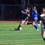 Michael S. Lockett / Juneau Empire 
JDHS forward Kyla Bentz (25) shoots on TMHS goal during a game at Adair-Kennedy Memorial Park on April 12, 2022.