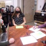 Paula Casperson (center) meets Wednesday at JDHS with Amanda Duvall (left) the district’s teacher and learning support coordinator, and Carrie Pusich, an activities assistant for the district. (Mark Sabbatini / Juneau Empire)