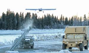 In this Jan. 30, 2014 photo, an RQ7 Shadow unmanned aircraft flies from its pneumatic catapult launcher at Joint Base Elmendorf-Richardson in Anchorage, Alaska. U.S. military bases in the Arctic and sub-Arctic are failing to harden their installations against long-term climate change as required, even though soaring temperatures and melting ice already are cracking base runways and roads and worsening flood risks up north, the Pentagons watchdog office said April 14, 2022. (AP Photo / Dan Joling)