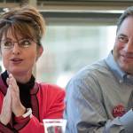 Then-canidate for governor Sarah Palin and running mate Sean Parnell listen to introductions during a Capital City Republican Women's luncheon at the UAS Recreation Center in September 2006. (Michael Penn / Juneau Empire File)