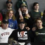 photos by Peter Segall / Juneau Empire
From left to right in front: Thunder Mountain High School students Noah Chambers, Wallace Adams and Preston Williams  who all grew up together on the same street  all signed on to play college sports at schools out of state on Wednesday.