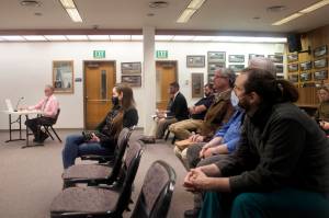 Audience members listen to Port Director Carl Uchytil present the proposed docks and harbors budget for next year to the City and Borough of Juneau Assembly’s Finance Committee on Wednesday. The public will get an opportunity to comment on the city’s full spending plan at an Assembly meeting at 7 p.m. Monday.(Mark Sabbatini / Juneau Empire)