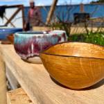 Some of the bowls available for selection by attendees of the Empty Bowls event, the Glory Halls annual fundraiser, sit on display at the shelters new garden. (Michael S. Lockett / Juneau Empire)