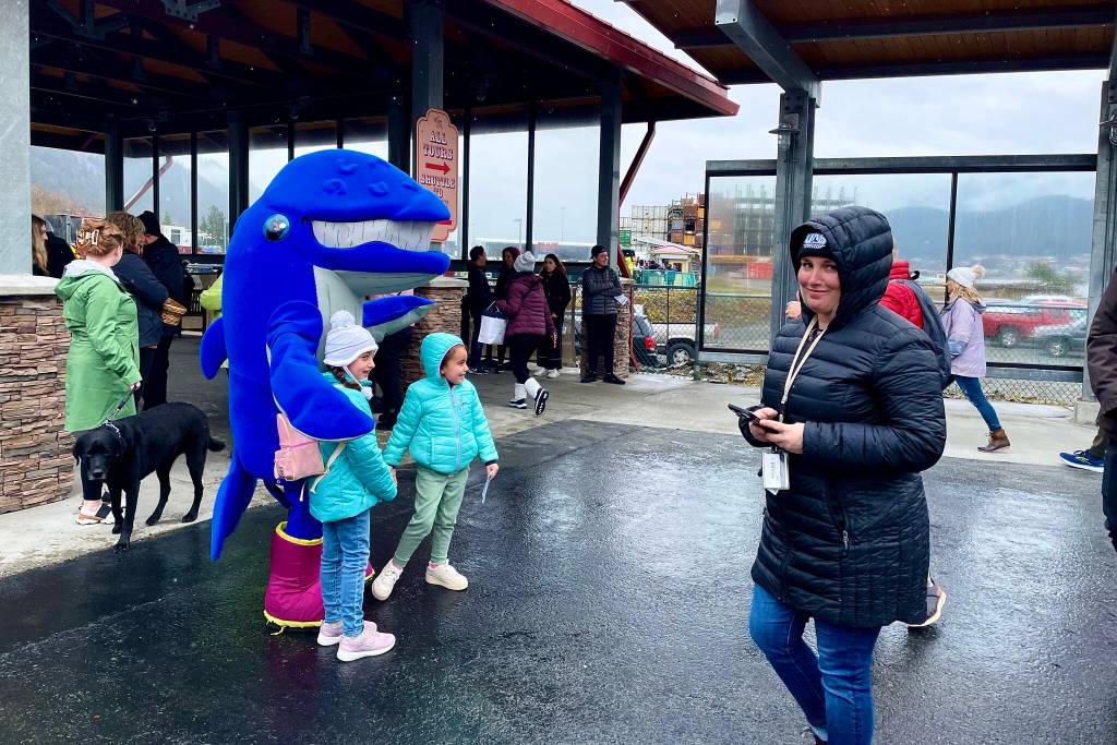 Photos by Michael S. Lockett / Juneau Empire
Spike, the University of Alaska Southeast mascot, poses for a photo with two children as passengers disembark Monday from the Norwegian Bliss.