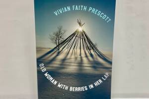 This photo shows “Old Woman With Berries in Her Lap,” a poetry collection, by Wrangell writer and poet Vivian Faith Prescott. She recently released two books, the second being "My Father’s Smokehouse,” a combination of recipes and stories. (Michael S. Lockett / Juneau Empire)