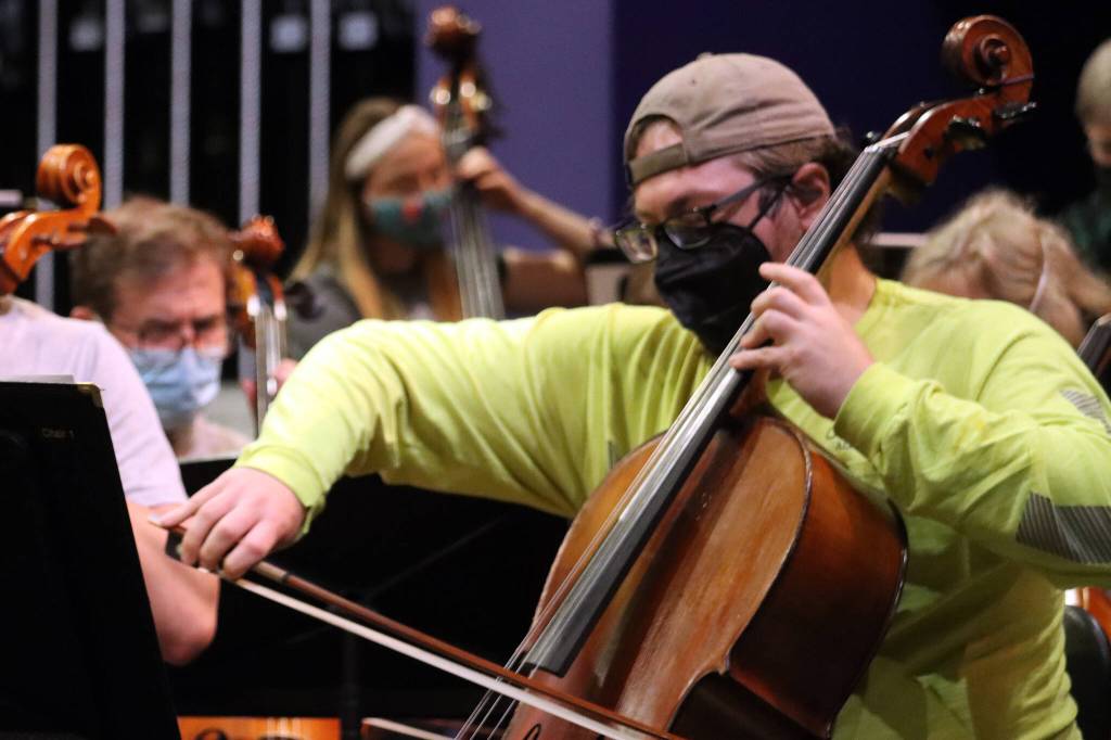 Ben Holtz plays a cello as the Juneau Symphony prepares for this weekends concert.