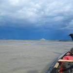 The author’s dog Cora rides a canoe on the Yukon River. Two-thirds of all the flowing water in Alaska makes its way into the Yukon. (Courtesy Photo / Ned Rozell)