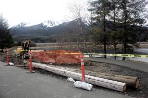 A 22-foot healing totem pole carved by master carver Wayne Price, who is Tlingit, is now being installed next to the fishing dock at Twin Lakes (Mark Sabbatini / Juneau Empire)