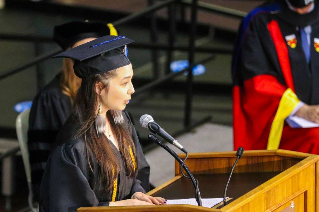 Student speaker Annie Masterman, who was receiving her bachelors degree, speaks during the commencement ceremony for University of Alaska Southeast on May 1, 2022. (Michael S. Lockett / Juneau Empire)