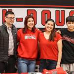 JDHS basketball player Trinity Jackson stands with friends and family after signing her letter of intent to play basketball for Skagit Valley College on May 4, 2022. (Michael S. Lockett / Juneau Empire)