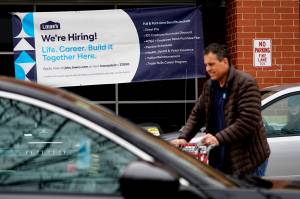 A hiring sign is displayed at a home improvement store in Northbrook, Ill., Thursday, May 5, 2022. Americas employers added 428,000 jobs in April, extending a streak of solid hiring that has defied punishing inflation, chronic supply shortages, the Russian war against Ukraine and much higher borrowing costs. (AP Photo / Nam Y. Huh)