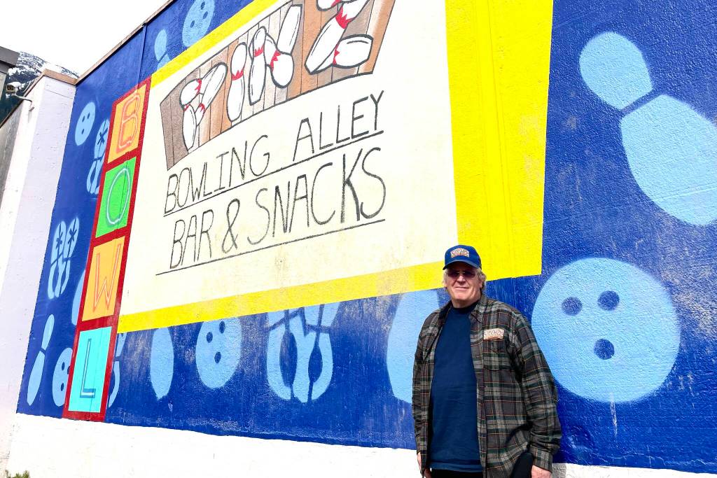 Bob Petersen has spent the last several years restoring and upgrading the bowling alley after previous management left it in ill repair, including commissioning a new mural for the outside wall. (Michael S. Lockett / Juneau Empire)