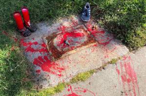 Red painted handprints cover the empty spot at a park in Albuquerque, New Mexico, on Thursday, July 1, 2021, where a historical marker for the Indigenous children who died while attending a boarding school nearby was removed. The U.S. Interior Department is expected to release a report Wednesday, May 11, 2022, that it says will begin to uncover the truth about the federal government's past oversight of Native American boarding schools.  (AP Photo / Susan Montoya Bryan,File)