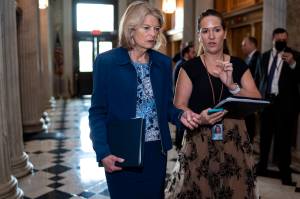 Sen. Lisa Murkowski, R-Alaska, speaks to an aide as senators arrive before a procedural vote on the Women's Health Protection Act to codify the landmark 1973 Roe v. Wade decision that legalized abortion nationwide, at the Capitol in Washington, Wednesday, May 11, 2022. President Joe Biden called on Congress to pass legislation that would guarantee the constitutional right to abortion services after the disclosure of a draft Supreme Court opinion that would overturn Roe v. Wade. (AP Photo / J. Scott Applewhite)