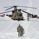Capt. Corey Wheeler, front, commander of B Company, 1st Battalion, 52nd Aviation Regiment at Fort Wainwright, Alaska, walks away from a Chinook helicopter that landed on the glacier near Denali, April 24, 2016, on the Kahiltna Glacier in Alaska. The U.S. Army helped set up base camp on North America's tallest mountain. The U.S. Army is poised to revamp its forces in Alaska to better prepare for future cold-weather conflicts, and it is expected to replace the larger, heavily equipped Stryker Brigade there with a more mobile, infantry unit better suited for the frigid fight, according to Army leaders. (AP Photo/Mark Thiessen, File)