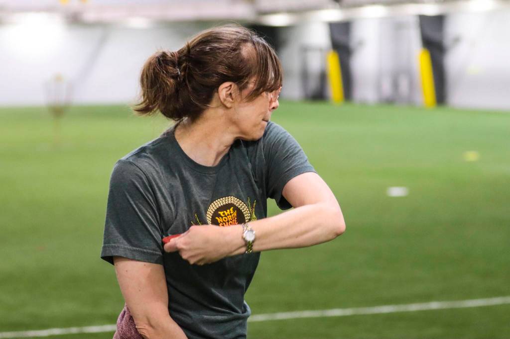 Michael S. Lockett / Juneau Empire
Irene Gallion prepares to hurl her disc downfield during a disc golf community workshop held by Uplay at Dimond Park Field House on May 12, 2022.