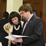 Sens. Shelley Hughes, R-Palmer, left, and Robert Myers, R-North Pole, read through one of 41 amendments submitted to the state's omnibus budget bill being debate on the floor of the Alaska State Senate on Monday, May 9, 2022. (Peter Segall / Juneau Empire)