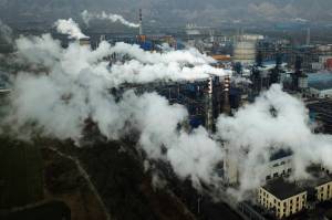 Smoke and steam rise from a coal processing plant in Hejin in central Chinas Shanxi Province on Nov. 28, 2019. A study released on Tuesday, May 17, 2022, blames pollution of all types for 9 million deaths a year globally, with the death toll attributed to dirty air from cars, trucks and industry rising 55% since 2000. (AP Photo / Sam McNeil File)