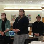 From the left, prosecutors Jessalyn Gillum, Katherine Lybrand and Detective Kathy Underwood stand as the jury for the trial of a fatal 2019 stabbing enter the courtroom. (Michael S. Lockett / Juneau Empire)