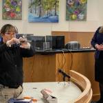 Detective Kathy Underwood of the Juneau Police Department shows the jury the weapon used to stab the victim in a 2019 attack to death during the trial on May 19, 2022. (Michael S. Lockett / Juneau Empire)