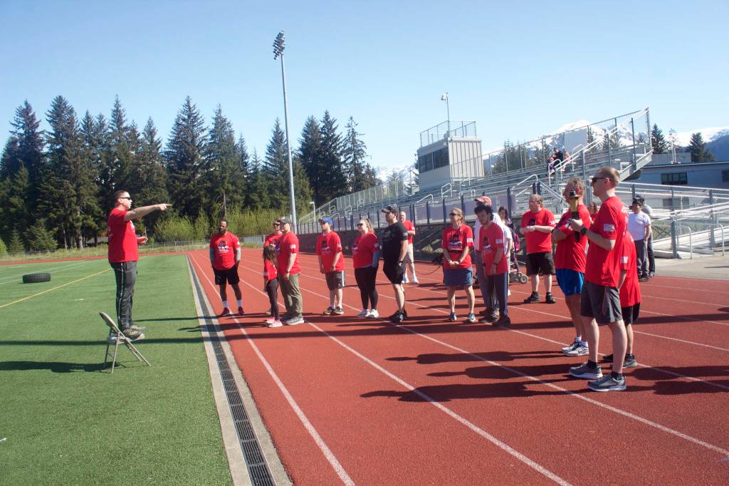 Kirt Stage-Harvey, a Juneau Police Department detective, briefs participants before the start of the Alaska Law Enforcement Torch Run on Saturday. (Mark Sabbatini / Juneau Empire)
