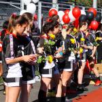 Underclass JDHS players prepare to hand flowers to seniors Blake Plummer, Brooke Sanford, Clara Don, Ella Goldstein, Kyla Bentz, Maile Quigley, Marina Lloyd, McKenna McNutt, Merry Newman, Natanya Reed, Sekoia Prince, Sierra Kanouse, Sophia Pugh and Zuri DeJean on senior night on May 19, 2022. Theyll play their final games as the #1 in the state championship. (Michael S. Lockett / Juneau Empire)