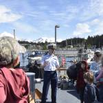 On the deck of the U.S. Coast Guard cutter Liberty, Lt. j.g. Quinn Levy gives visitors a history of the vessel to guests on Thursday, May 26, 2022. The Liberty has been stationed in Juneau for more than 30 years but is being re-homeported in Valdez. (Peter Segall / Juneau Empire)