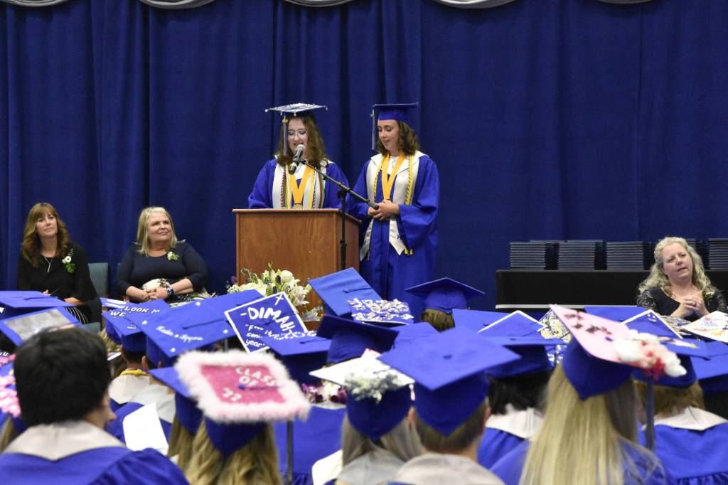 Thunder Mountain High School valedictorians Devin Moorehead, left, and Grace Sikes, deliver remarks to the class of 2022 graduation ceremony on Sunday, May 29, 2022. (Peter Segall / Juneau Empire)