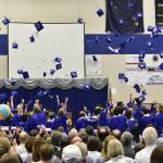 Thunder Mountain High School students throw their caps in celebration at the graduation ceremony for the class of 2022 on Sunday, May 29, 2022. (Peter Segall / Juneau Empire)