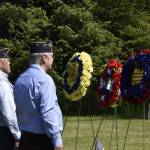 From left to right, William Clutton, Ed Grant, and Bill Morris, lay wreaths at a Memorial Day ceremony at the Alaska Memorial Park in the Mendenhall Valley on Monday, May 30, 2022. (Peter Segall / Juneau Empire)