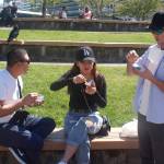 Cruise ship workers Leo Garcia, left, Joan Rosos, center, and Gerald Gasper take an ice cream break Wednesday in Marine Park, where the temperature at about 2 p.m. was 77 degrees, one degree below the record set in 1958. A record high of 78 degrees occurred in Juneau on Tuesday, as well as a record high of 74 degrees in Yakutat, with more record temperatures possible in Southeast Alaska this week before cooler weather and rain arrive this weekend, (Mark Sabbatini / Juneau Empire)