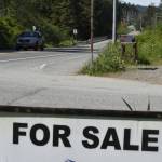 A sign on the Douglas Highway advertises a home for sale on Thursday, June 2, 2022. Home prices in Alaska have been increasing for the past two years but an expected increase to interest rates might cool off the market. (Peter Segall / Juneau Empire)